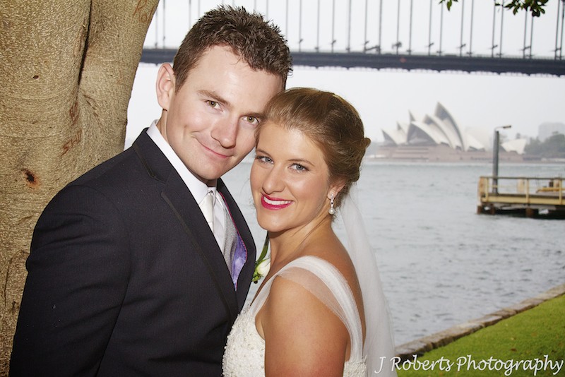 Couple smiling at the camera at Blues Point North Sydney - wedding photography sydney